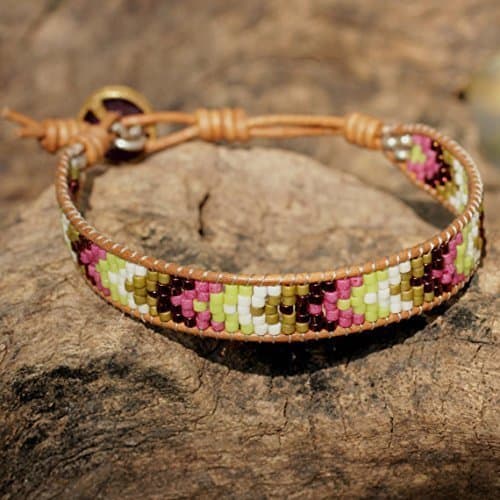 Stunning beaded friendship style bracelet with amethyst closure.
